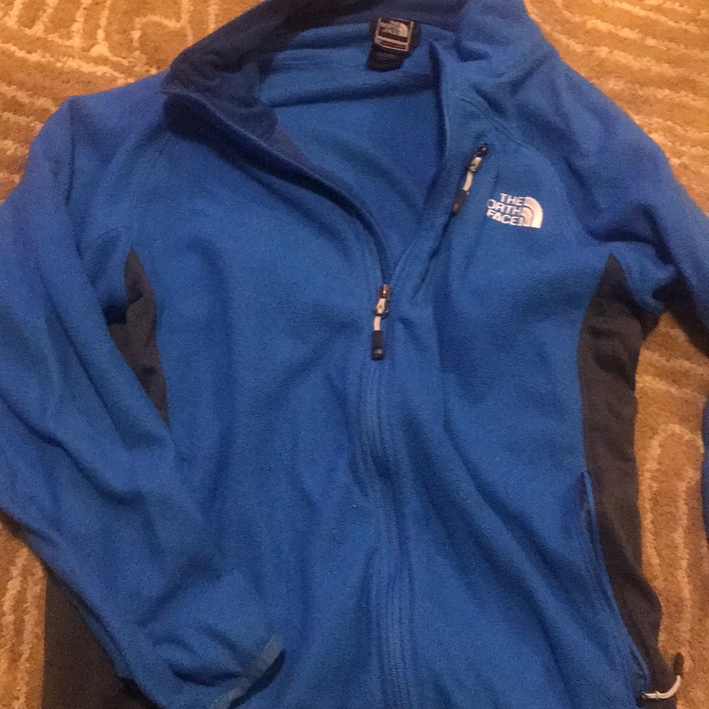 north face. Multiple pockets. Worm but good shape